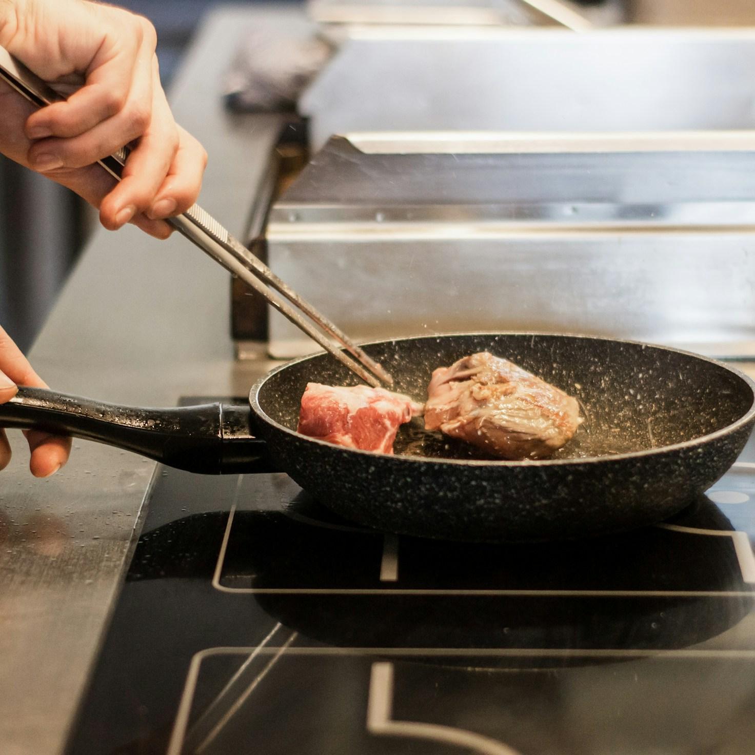 Diverse group of community members sharing a meal together, showcasing the social bonds formed through collaborative cooking